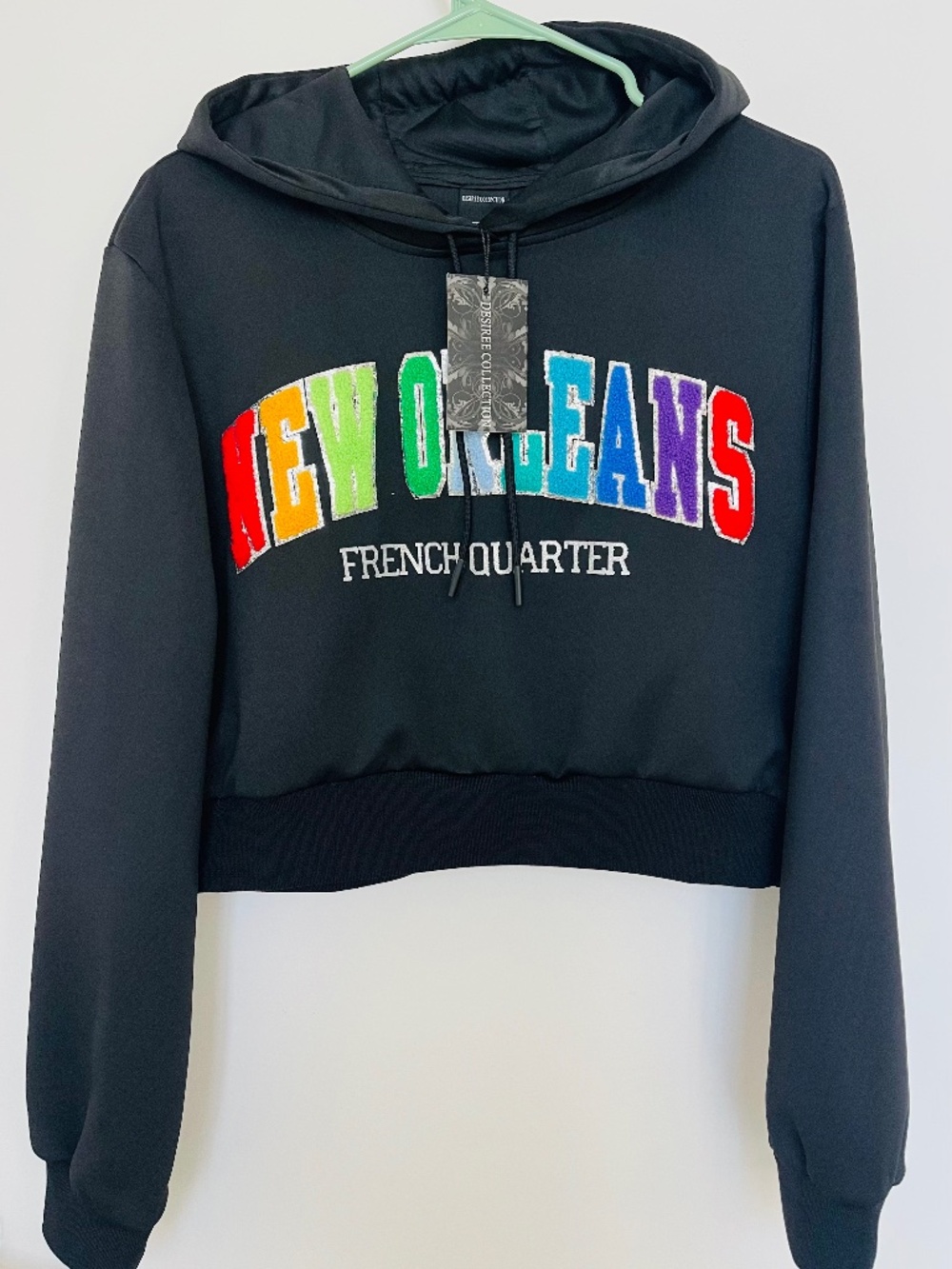 NWT Desiree Collection Women’s M Black Cropped Pullover Hoodie New Orleans Logo